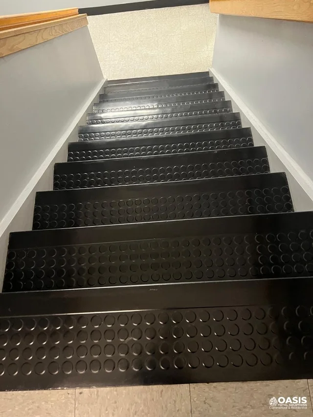 School hallway before cleaning with lockers and cleaning equipment