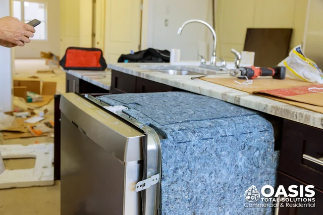 Dishwasher set in place under the counter