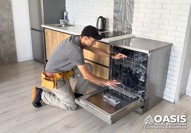 Technician inspecting dishwasher racks