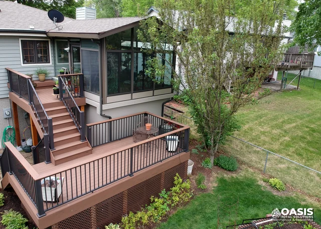 Multi-level composite deck with black metal railings