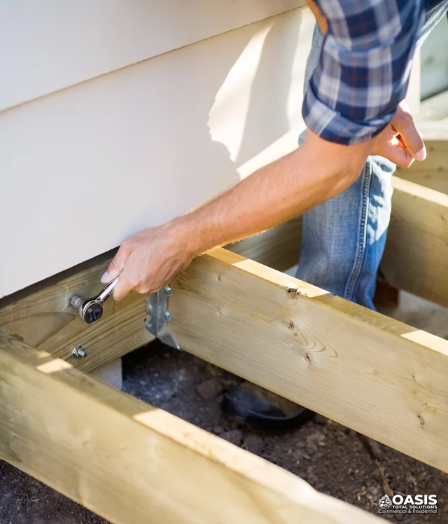 Tightening ledger bolt during deck framing