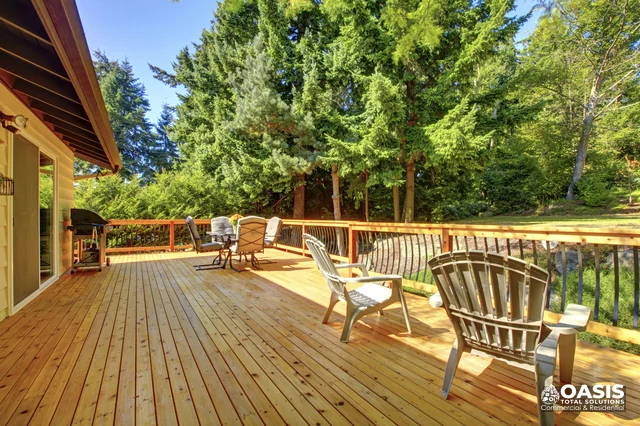 Spacious cedar deck with seating and grill