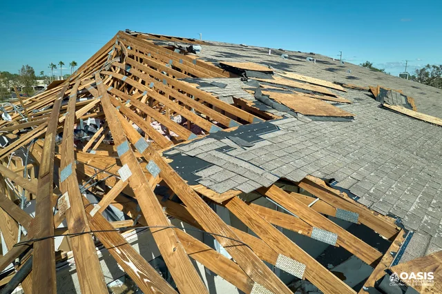 Roof with damaged framing and shingles lifted by strong winds