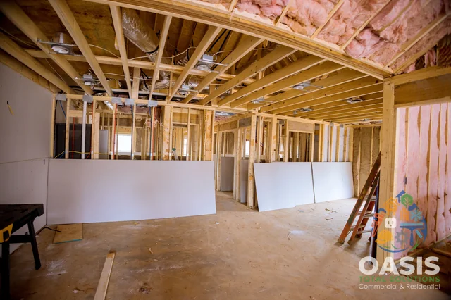 Residential renovation—framing with drywall stacked for install