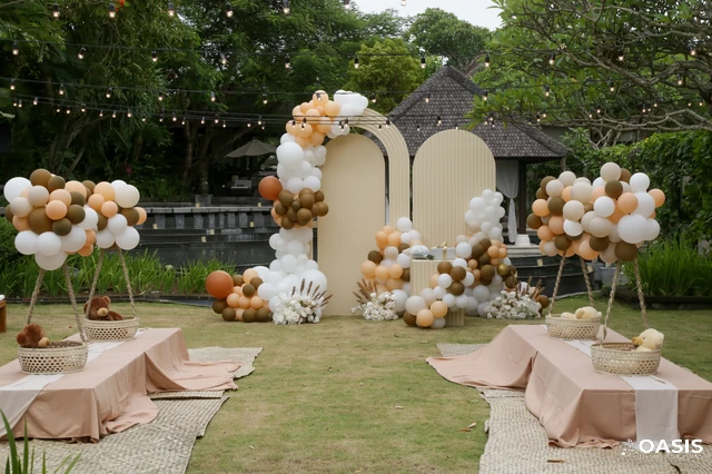 Baby shower balloon arch and picnic-style seating