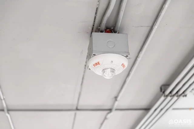 Ceiling-mounted fire alarm strobe with FIRE lettering