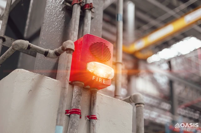 Industrial fire alarm horn-strobe on a column