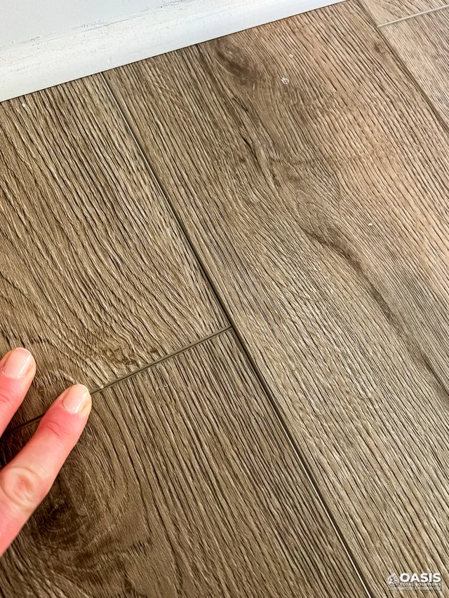Aligning vinyl plank seam near baseboard
