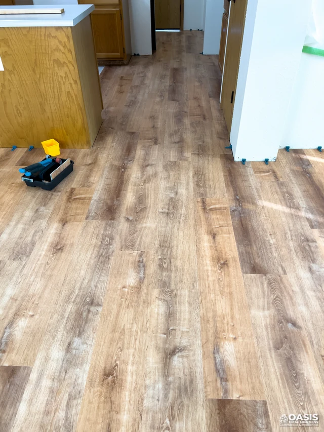 Installed luxury vinyl plank flooring in kitchen