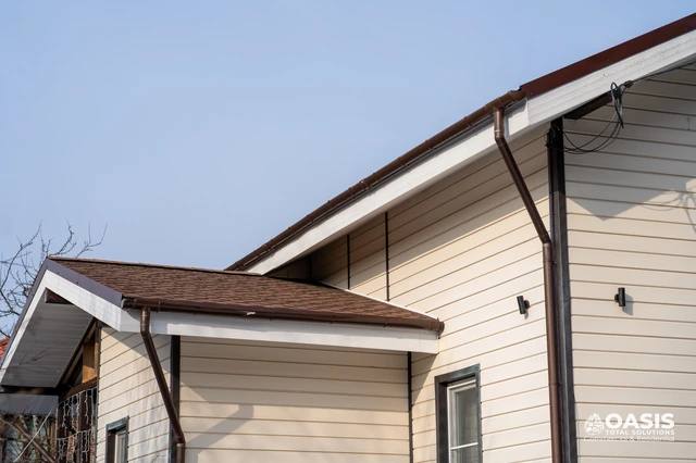 Brown K-style gutters around intersecting rooflines