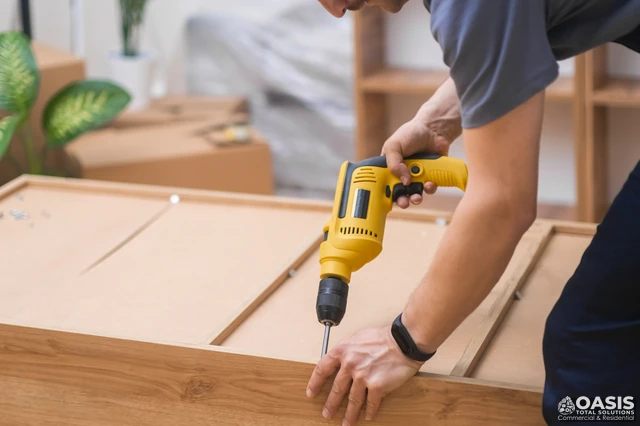Assembling a flat-pack cabinet with a cordless drill