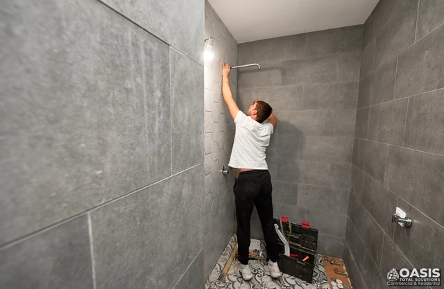 Installing a shower arm/rail on a tiled wall