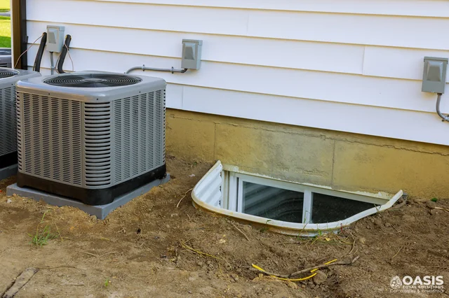 Outdoor AC condensers beside foundation