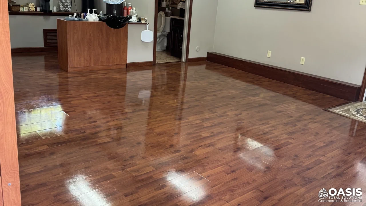 Detail cleaning on wood-look flooring in a client-facing commercial interior