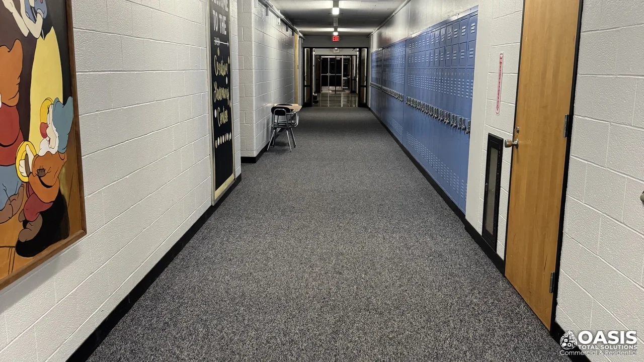 Carpet cleaning in a corridor or entry route inside an occupied building