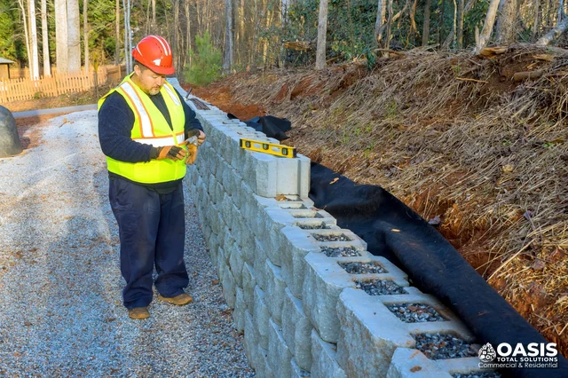 Retaining wall construction with blocks