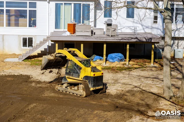 Skid steer grading backyard