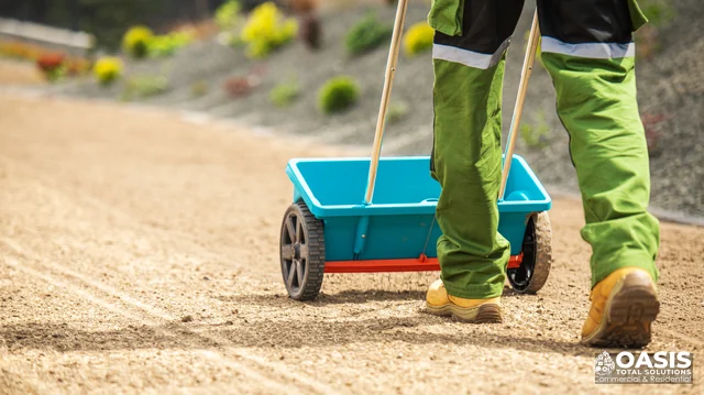 Push spreader on landscape pathway