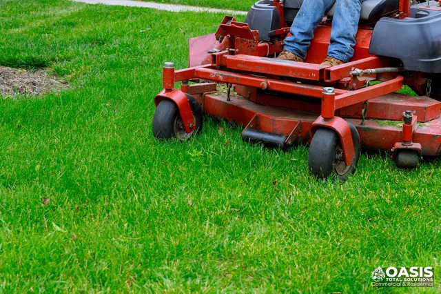 Zero-turn mower cutting grass
