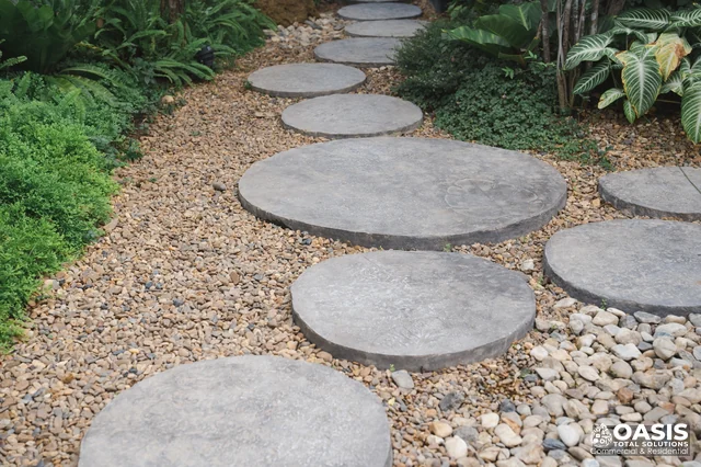 Round stepping stones on gravel path