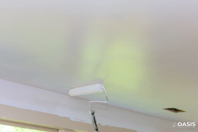 Interior ceiling painting with roller and even coverage