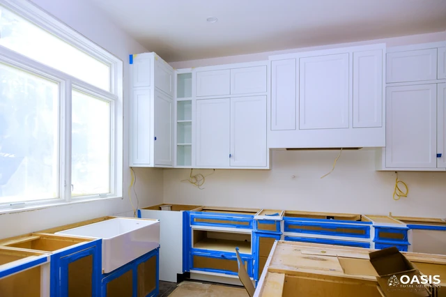 Kitchen cabinet repaint prep with masking and new panels