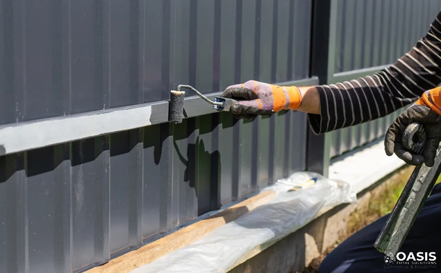 Repainting exterior metal fence with small roller