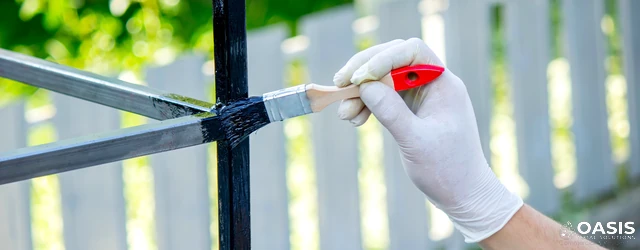 Hand painting outdoor metal frame with protective black coat