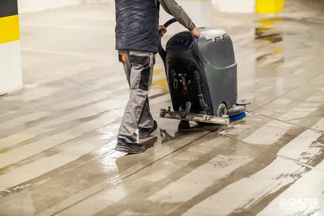 Parking garage floor scrubbing with an auto scrubber