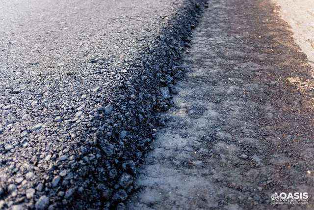 New asphalt mat meeting the milled edge