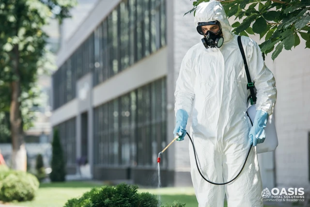 Exterior pest control treatment around a commercial building