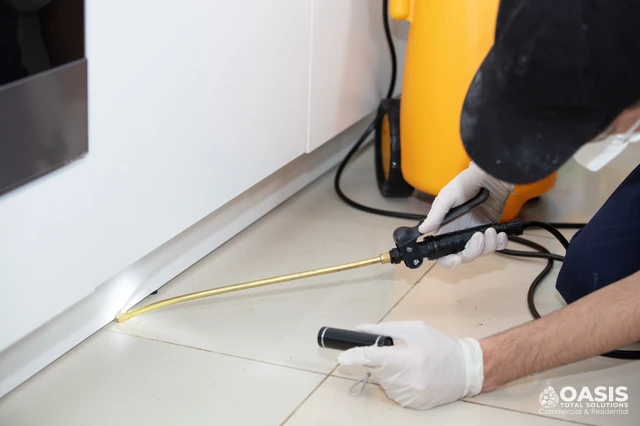 Precision pest control application under appliances and toe-kicks