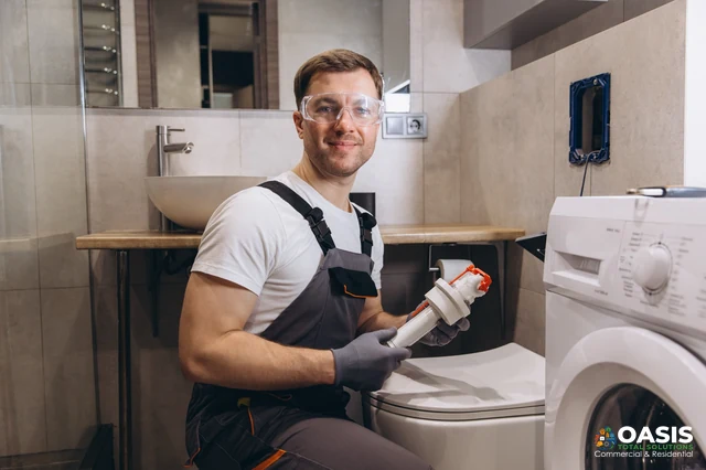Technician holding a water filter cartridge during hookup