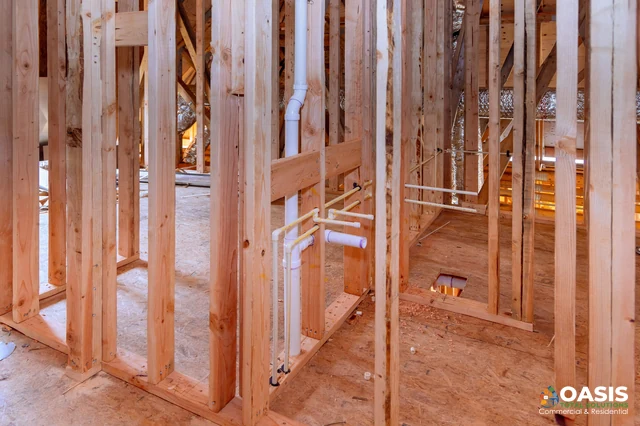 DWV vertical stack and branch lines in framed bathroom