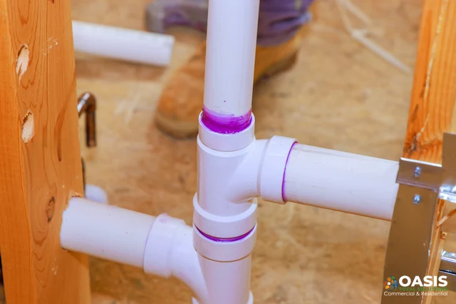 Close-up of PVC T-fitting with purple primer