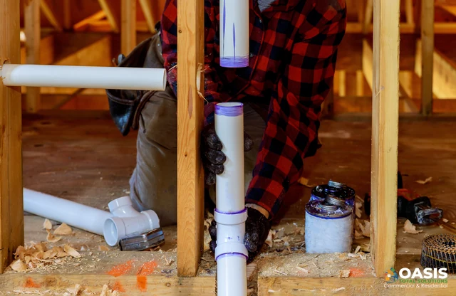 Setting vertical PVC pipe with purple primer