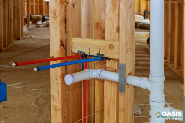 Red and blue PEX supply lines with PVC drain