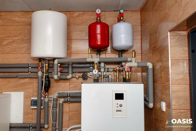 Boiler system, pumps and insulated piping on wall