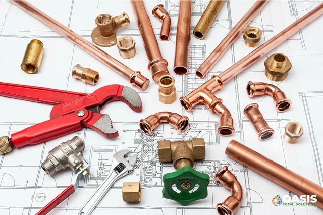 Copper pipes, fittings and wrenches on plan drawing
