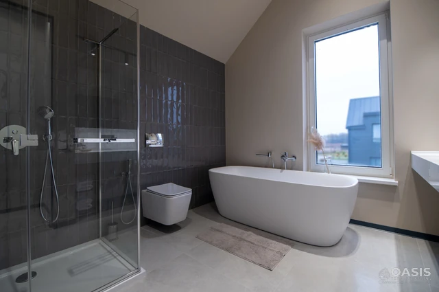 Contemporary bathroom with soaking tub, tile wall and frameless shower