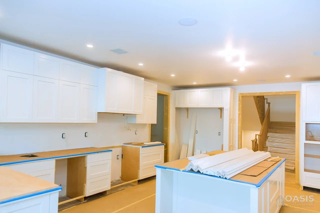 In-progress kitchen with shaker cabinets ready for countertops