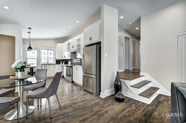 View from dining to renovated kitchen with stainless appliances