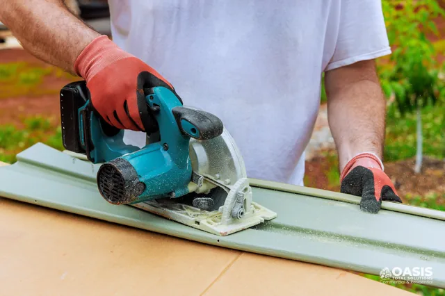 Cutting a siding panel with a cordless circular saw on a workbench