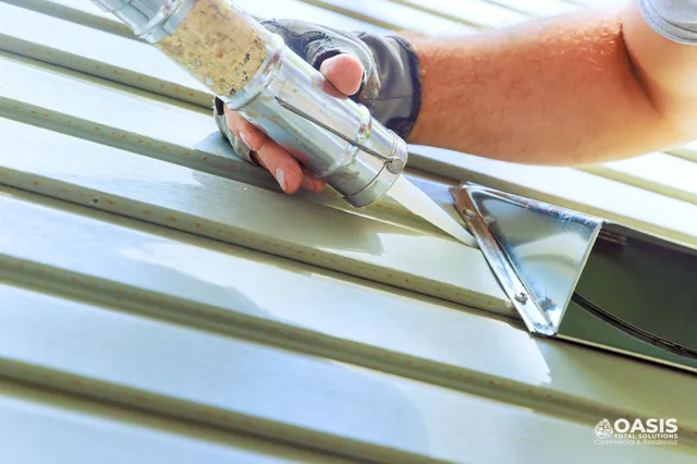 Applying exterior caulk around a wall vent on lap siding