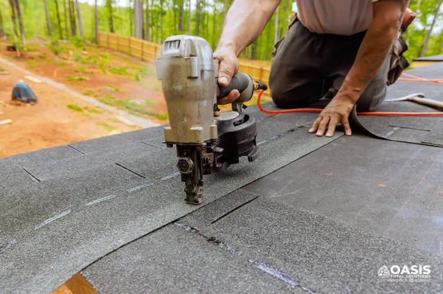 Starter row being secured with a nail gun before full shingle run