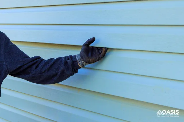 Checking vinyl siding lock and reveal during install